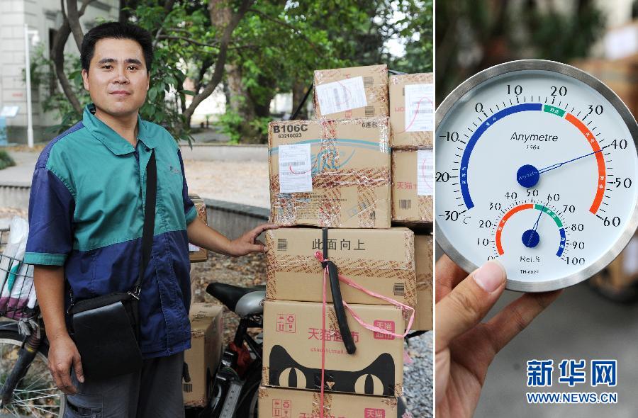 A delivery guy Yang prepares to distribute goods around Hangzhou city on July 24. The thermometer showed the temperature was over 40 degree at that time in Hangzhou. (Xinhua/ Ju Huanzong)