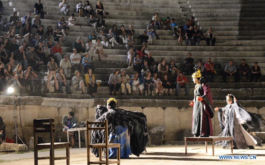 People watch the Chinese version of Shakespeare's drama Charles III in Bitola, Macedonia, July 25, 2013. The Chinese version of Shakespeare's drama Charles III was staged on Thursday night as the final show of the Shakespeare Drama Festival at a roman amphitheatre in Bitola. (Xinhua/Jia Zhou)