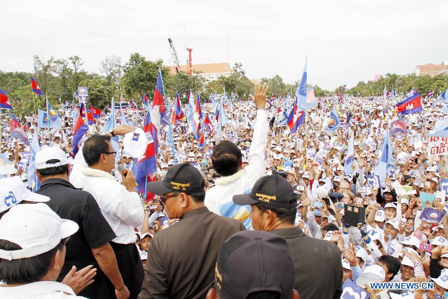 Supporters of the Cambodia's opposition Party -- National Rescue Party attend a campaign rally at the Freedom Park in Phnom Penh, Cambodia, July 26, 2013. Cambodia's fifth parliamentary elections are ready to kick off on Sunday, a National Election Committee (NEC) official said Friday. (Xinhua/Sovannara)