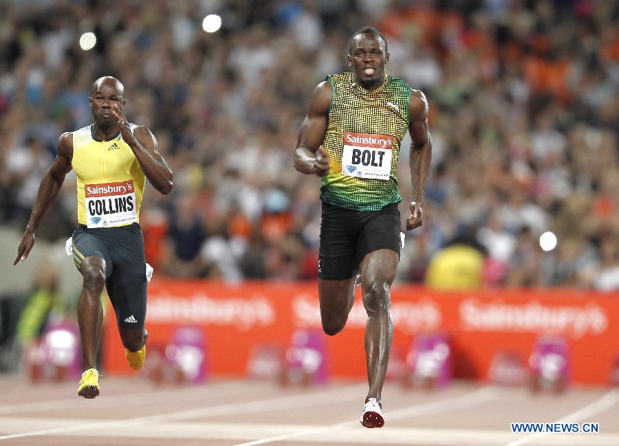 Usain Bolt (R) of Jamaica competes during the men's 100m race at the London Diamond League 'Anniversary Games' athletics meeting at the Olympic Stadium in London, Britain, on July 26, 2013. Bolt claimed the title with 9.85 seconds. (Xinhua/Yin Gang)