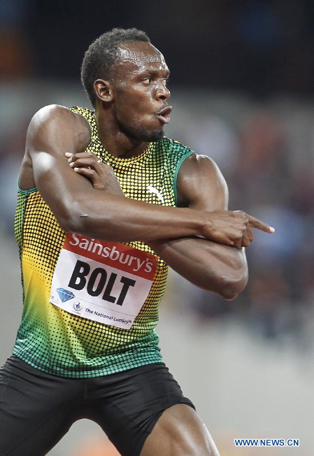 Usain Bolt of Jamaica reacts after winning the men's 100m race at the London Diamond League 'Anniversary Games' athletics meeting at the Olympic Stadium in London, Britain, on July 26, 2013. Bolt claimed the title with 9.85 seconds. (Xinhua/Yin Gang)