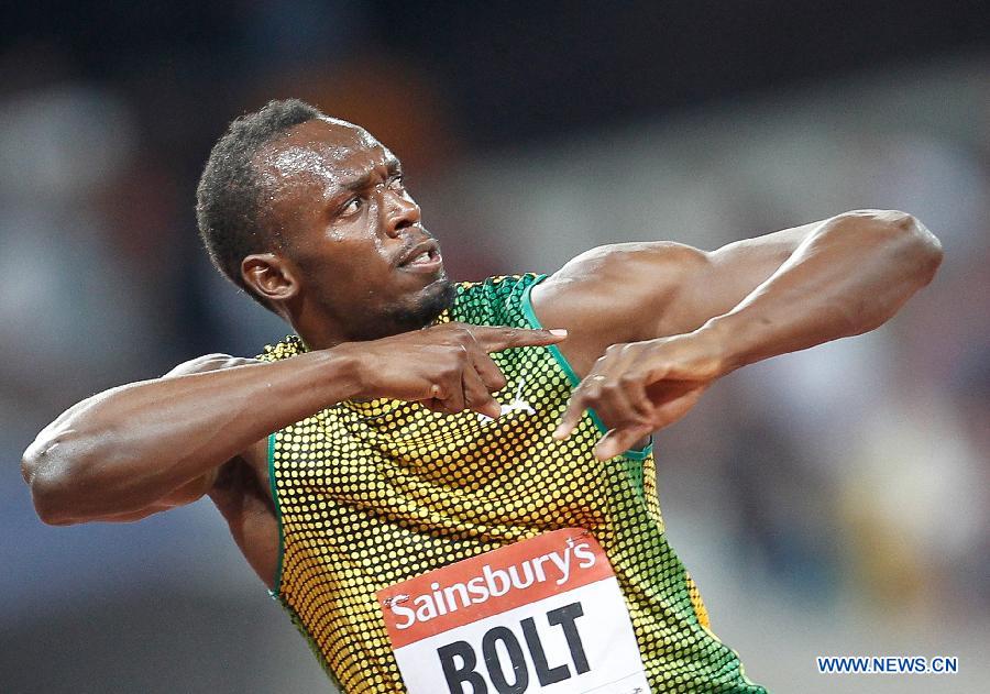 Usain Bolt of Jamaica reacts after winning the men's 100m race at the London Diamond League 'Anniversary Games' athletics meeting at the Olympic Stadium in London, Britain, on July 26, 2013. Bolt claimed the title with 9.85 seconds. (Xinhua/Yin Gang)