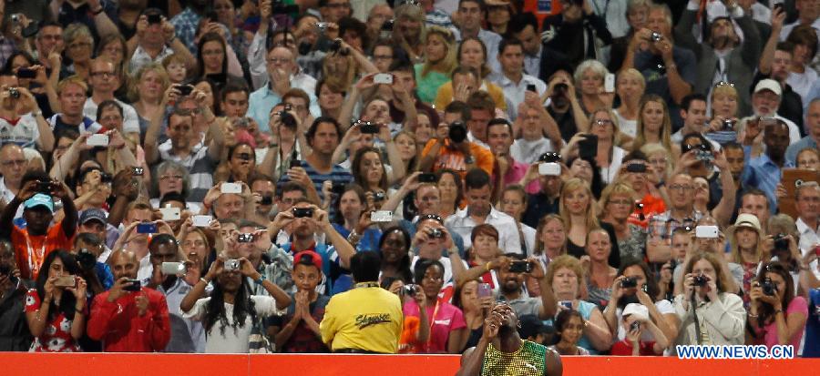 Usain Bolt of Jamaica reacts ahead of the men's 100m race at the London Diamond League 'Anniversary Games' athletics meeting at the Olympic Stadium in London, Britain, on July 26, 2013. Bolt claimed the title with 9.85 seconds. (Xinhua/Yin Gang)