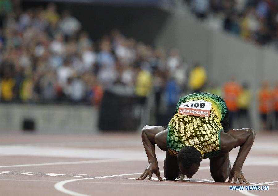 Usain Bolt of Jamaica reacts after winning the men's 100m race at the London Diamond League 'Anniversary Games' athletics meeting at the Olympic Stadium in London, Britain, on July 26, 2013. Bolt claimed the title with 9.85 seconds. (Xinhua/Yin Gang)