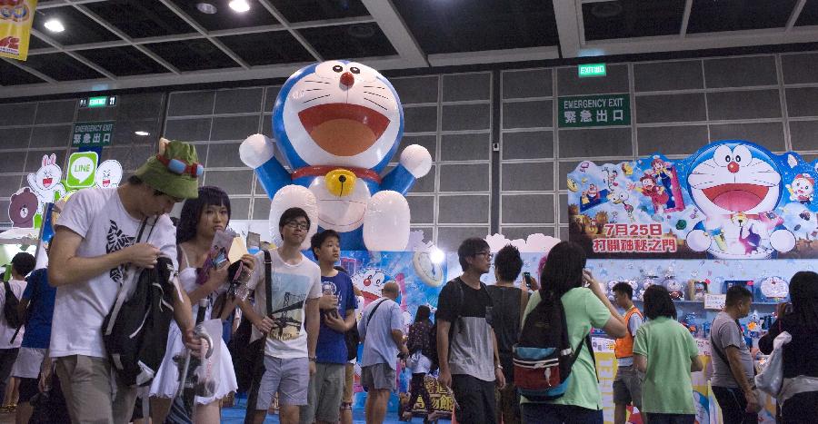 People visit the Animation, Comics & Games Expo in Hong Kong (ACGHK), south China, July 26, 2013. The five-day ACGHK, starting here Friday, is expected to attract some 700,000 visitors. (Xinhua/Zhao Yusi) 
