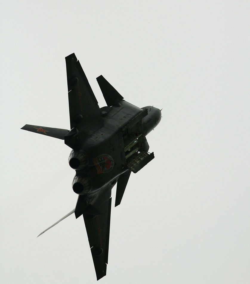 A clear view of the 2nd prototype J20 flying low with weapons bay open. The configuration shown here carries four radar-guided Beyond Visual Range air/air missiles. Additional weapons bays on the fuselage sides can also carry similar weapons or passive, heat-seeking AAMs.(Source: huanqiu.com)