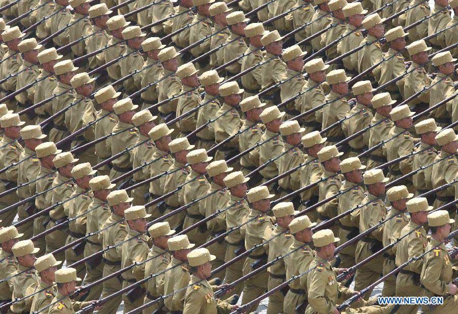 Soldiers march at a military parade in Pyongyang, the Democratic People's Republic of Korea (DPRK), July 27, 2013. DPRK held a military parade marking the 60th anniversary of the Korean War Armistice Agreement here on Saturday, the official KCNA news agency reported. (Xinhua/Zhang Li)