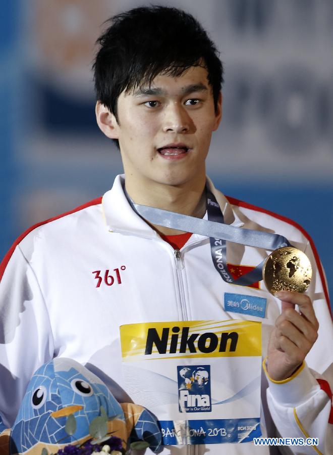 Sun Yang of China celebrates after the Men's 400m Freestyle Final of the Swimming competition on day 9 of the 15th FINA World Championships at Palau Sant Jordi in Barcelona, Spain on July 28, 2013. Sun Yang claimed the title with 3 minutes 41.59 seconds.(Xinhua/Guo Yong) 