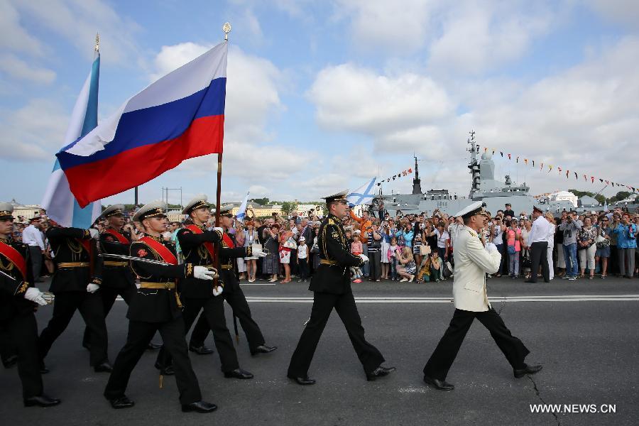 Russian navy soldiers march during a parade to celebrate the Navy Day in St. Petersburg, July 28, 2013. The Navy Day is a national holiday in Russia that normally takes palce on the last Sunday of July. (Xinhua)
