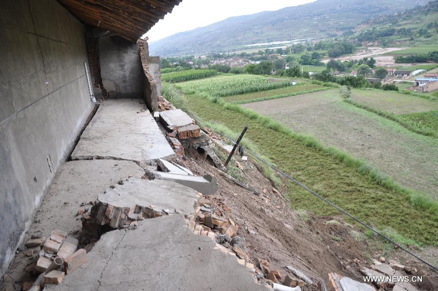 A house is seen damaged in rainstorm-hit Zhangjiachuan Hui Autonomous County in northwest China's Gansu Province, July 28, 2013. (Xinhua/Dou Miaomiao) 