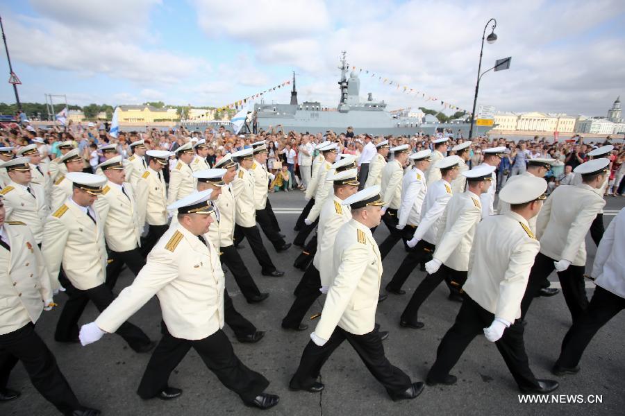 Russian navy soldiers march during a parade to celebrate the Navy Day in St. Petersburg, July 28, 2013. The Navy Day is a national holiday in Russia that normally takes palce on the last Sunday of July. (Xinhua) 