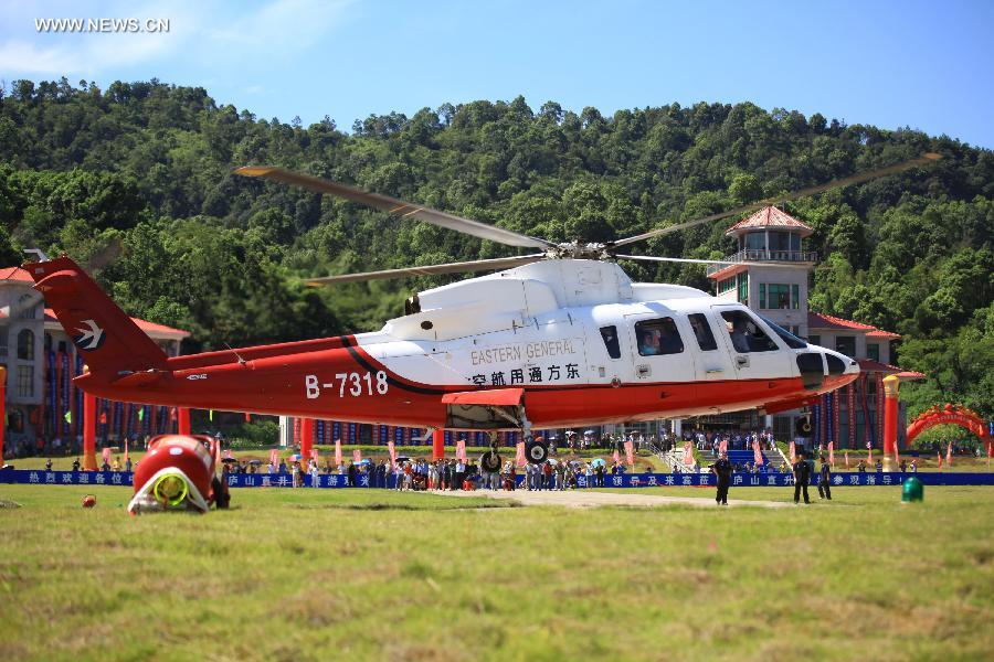 A helicopter is seen taking off in Lushan Mountainof Jiujiang City, east China's Jiangxi Province, July 28, 2013. Helicopters are to be used for sightseeing in the famous scenery area on Sunday. (Xinhua/Zhang Haiyan)