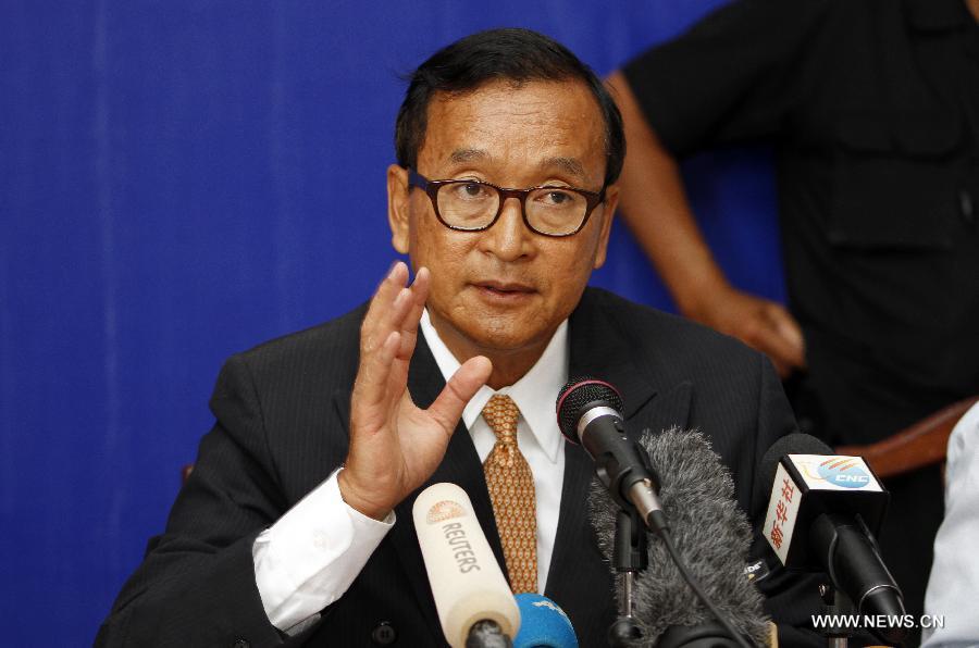 The main opposition Cambodia National Rescue Party (CNRP)'s leader Sam Rainsy speaks during a press conference at the party's headquarters in Phnom Penh, Cambodia, July 29, 2013. The CNRP on Monday rejected the preliminary results of Sunday's general elections, claiming "serious irregularities". (Xinhua/Sovannara)