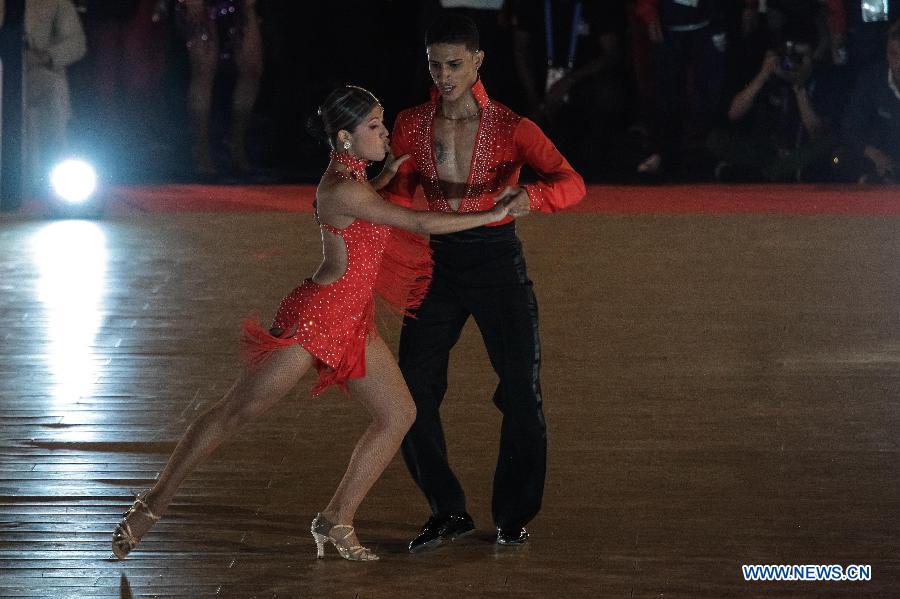 Colombian atlhetes Jefferson Benjumea (R) and Adriana Davila compete in Sports Dancing on Salsa category during the IX World Games 2013, in Caly City, Colombia, on July 28, 2013. (Xinhua/Jhon Paz)
