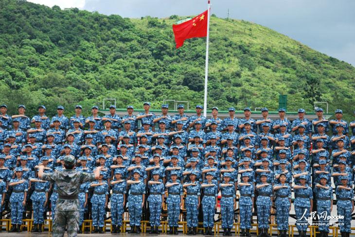 The picture shows Hong Kong teenagers attend a graduation ceremony of the military summer camp on July 28, 2013.  (People's Daily Online/Guo Xiaotong)