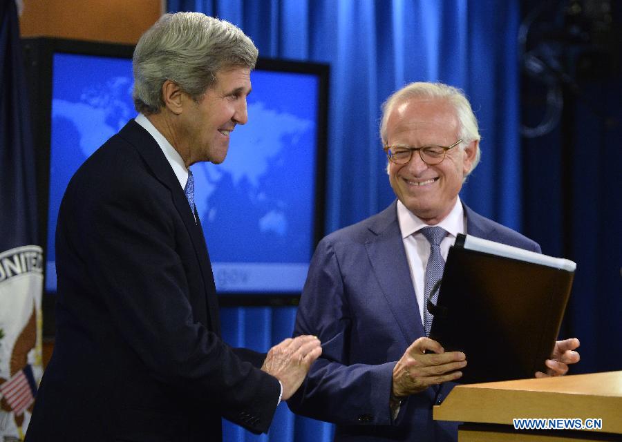 U.S. Secretary of State John Kerry (L) talks with Martin Indyk, a former U.S. ambassador to Israel, after naming him as the special envoy to guide the Israeli-Palestinian peace talks, during a press conference at the State Department in Washington D.C., capital of the United States, July 29, 2013. The Israeli and Palestinian negotiators are set to begin their "initial talks" on Monday evening to lay the groundwork for final status negotiations, which will last at least nine months. (Xinhua/Zhang Jun)