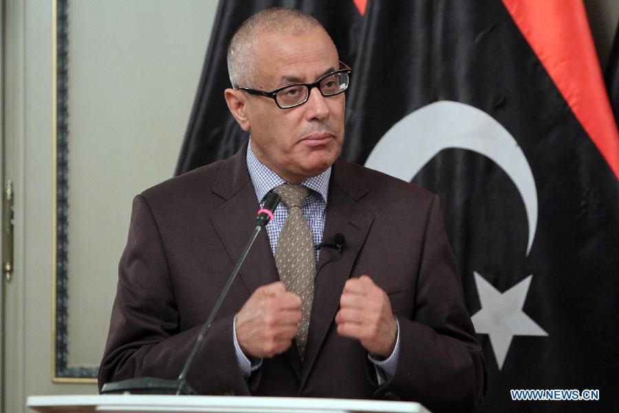 Libyan Prime Minister Ali Zeidan speaks during a press statement announcing a cabinet reshuffle in the coming days and recent developments in the security situation in Libya, July 29, 2013. (Xinhua/Hamza Turkia)