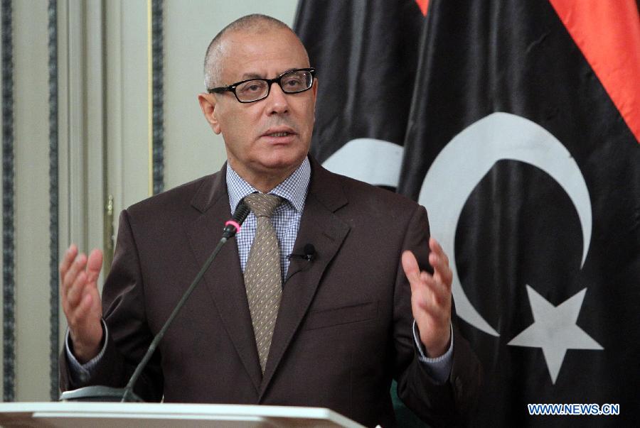 Libyan Prime Minister Ali Zeidan speaks during a press statement announcing a cabinet reshuffle in the coming days and recent developments in the security situation in Libya, July 29, 2013. (Xinhua/Hamza Turkia)