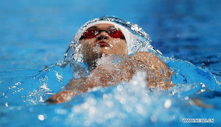 Xu Jiayu of China competes during Men's 100m Backstroke Heats of the Swimming competition on day 10 of the 15th FINA World Championships at Palau Sant Jordi in Barcelona, Spain on July 29, 2013. Xu Jiayu advanced to the semifinal with 53.63 seconds.(Xinhua/Wang Lili)