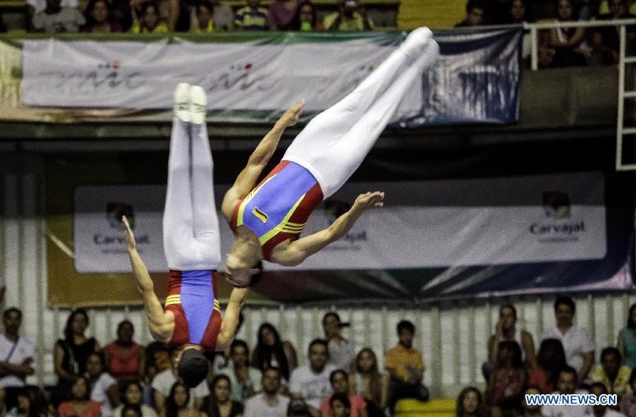 Carlos Paez and Juan Valcarcel of Colombia compete during the men's synchronized final of trampoline event at the IX World Games 2013, in Cali City, Colombia, on July 29, 2013. (Xinhua/Jhon Paz)