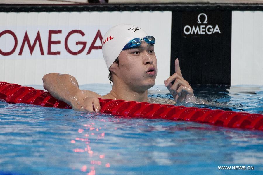 China's Sun Yang reacts after the men's 800m freestyle heats of the swimming competition at the 15th FINA World Championships in Barcelona, Spain on July 30, 2013. (Xinhua/Xie Haining)