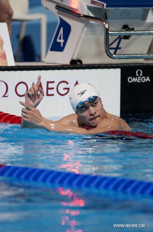 China's Sun Yang reacts after the men's 800m freestyle heats of the swimming competition at the 15th FINA World Championships in Barcelona, Spain on July 30, 2013. (Xinhua/Xie Haining)