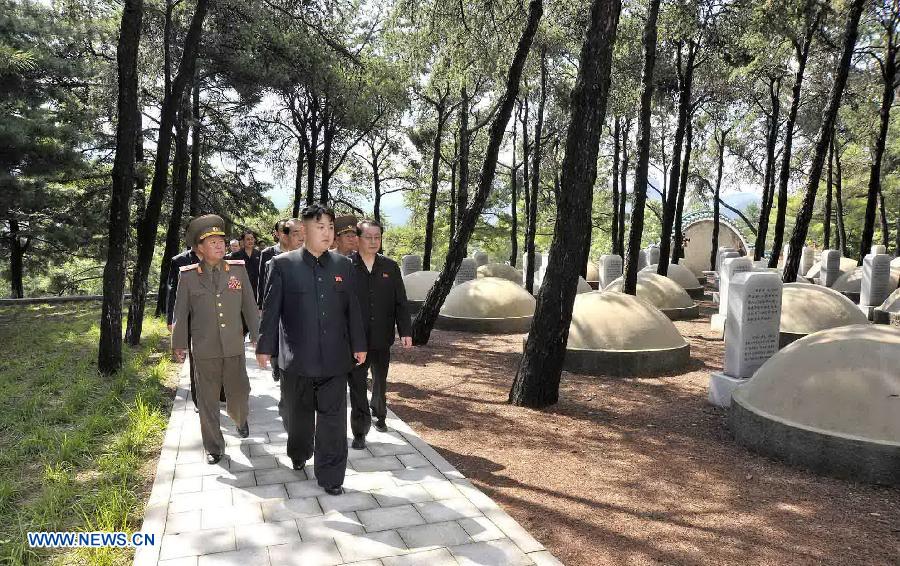 Photo taken on July 29, 2013 shows Kim Jong Un (Front), top leader of the Democratic People's Republic of Korea (DPRK), visiting a cemetery in Hoechang County, South Phyongan Province, DPRK. Kim Jong Un, top leader of the Democratic People's Republic of Korea (DPRK), visited a cemetery on Monday to mourn fallen Chinese fighters in the Korean War, the official news agency KCNA reported on Tuesday. (Xinhua/KCNA)