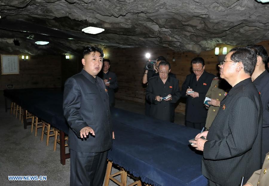 Photo taken on July 29, 2013 shows Kim Jong Un (L), top leader of the Democratic People's Republic of Korea (DPRK), visiting the Songhung Revolutionary Site in Hoechang County, South Phyongan Province, DPRK. Kim Jong Un, top leader of the Democratic People's Republic of Korea (DPRK), visited a cemetery on Monday to mourn fallen Chinese fighters in the Korean War, the official news agency KCNA reported on Tuesday. (Xinhua/KCNA)