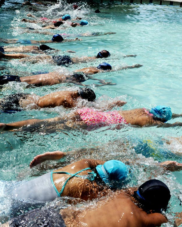 On July 23, children of migrant workers learn to swim in a swimming pool in Wuyi County, east China’s Zhejiang province. During this summer, many swimming pools in Wuyi County provide swimming training for children of migrant workers to improve the ability to save themselves. (Xinhua/Zhang Jiancheng)