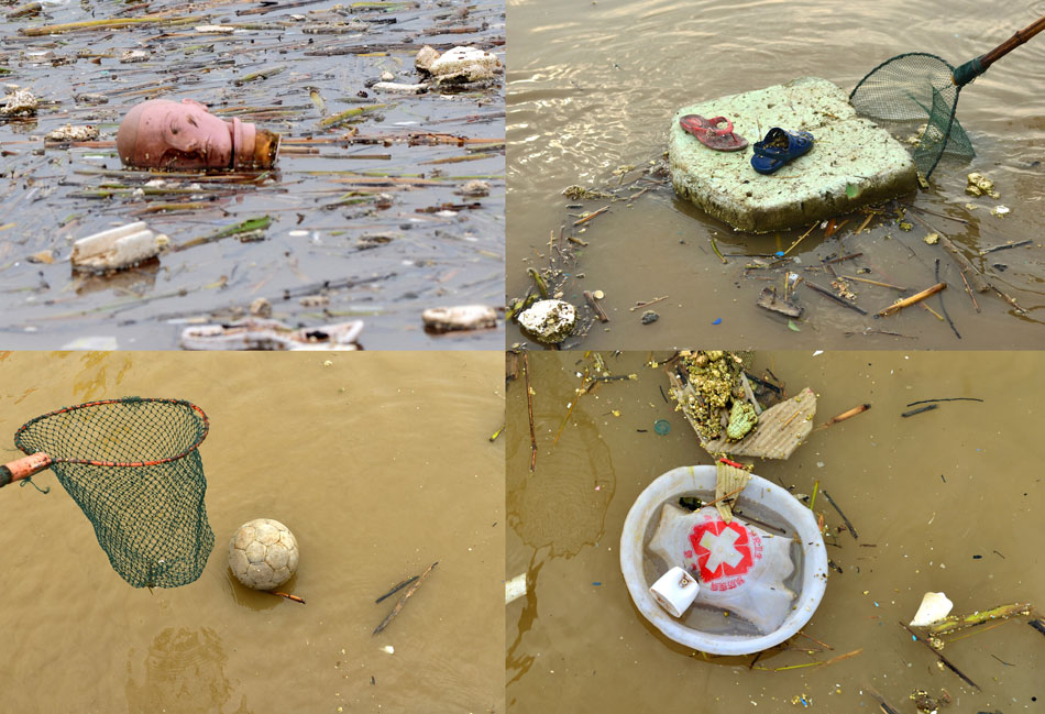 Photos taken on July 23 show the floating trash in Three Gorges Reservoir area. Since early July, large amount of floating trash has drifted into the Three Gorges Reservoir area from headwaters and tributaries of Yangze River. Environmental Protection Agency of Zigui, Wuhan has made efforts to prevent waters from being polluted and ship navigation from being disturbed. (Xinhua/Zhen Jiayu)