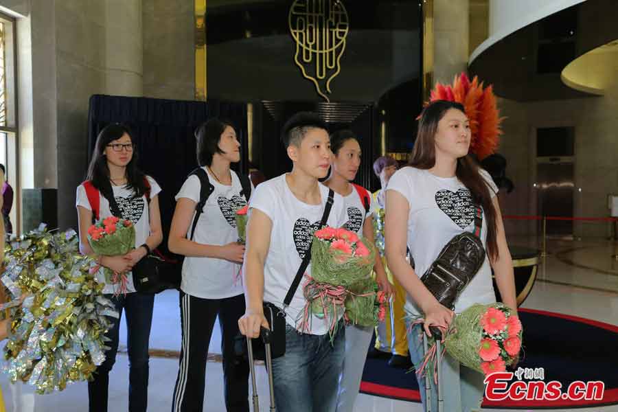 The China women's national volleyball team arrived in Macao yesterday for the upcoming FIVB Volleyball World Grand Prix Macau 2013. The tournament will take place from Friday to Sunday at the Macao Forum. This will be the first international sporting event for Lang Ping as the team's new head coach. Photo shows the team members, including Wang Yimei (R Front) and Zhang Lei (L Front). (CNS / Long Tuyou)