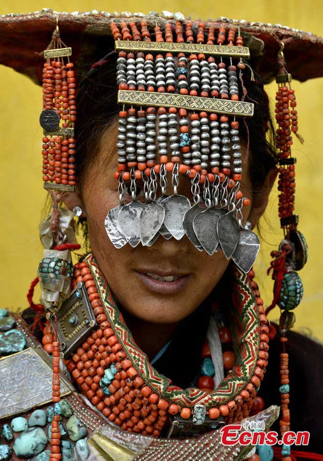 A Tibetan woman in traditional 'peacock costume' in a village of Burang County, Ngari Prefecture.(CNS/Li Lin)