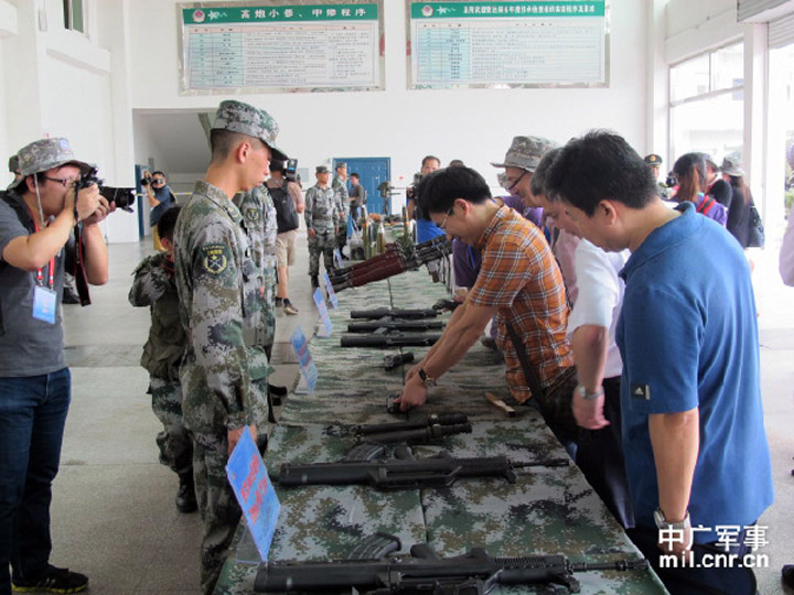 The picture shows Chinese and overseas reporters visit logistics supplies of the air-defense brigade under the Lanzhou MAC of the PLA.