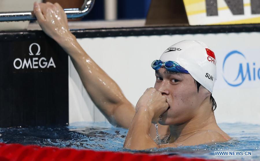 Sun Yang of China reacts after winning the men's 1,500m freestyle final of the swimming competition at the 15th FINA World Championships in Barcelona on Aug. 4, 2013. Sun Yang won the 3rd gold of World Championship with 1,500m freestyle triumph. (Xinhua/Wang Lili)