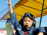 5-year-old son of ‘eagle dad’ flies in Beijing
