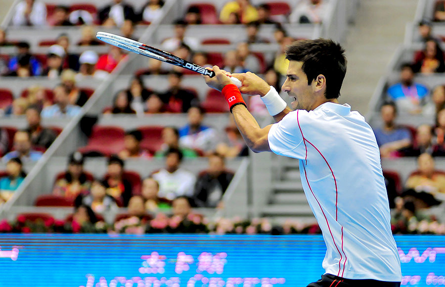 World No. 1 men's tennis player Novak Djokovic plays in the first round of the China Open tennis tournament. (Li Zhenyu/People's Daily Online)