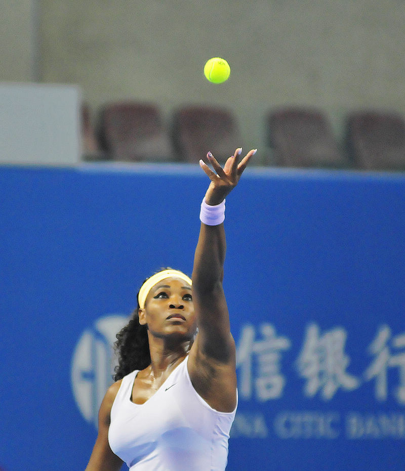 Serena Williams serves in the quarterfinals of the China Open against Caroline Wozniacki. (Li Zhenyu/People's Daily Online)