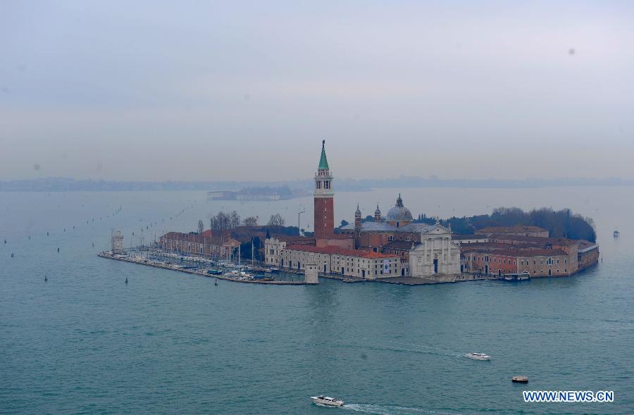 Photo taken on December 21, 2013 shows the San Giorgio Maggiore island in Venice, Italy. Venice is located in northeastern Italy and it's the capital city of Veneto region. Being separated by canals and linked by bridges, Venice is famous for its beautiful view and architecture. The city with its lagoon has been listed as a World Heritage by UNESCO in 1987. (Xinhua/Xu Nizhi)