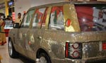 Luxurious car adorned with coins
