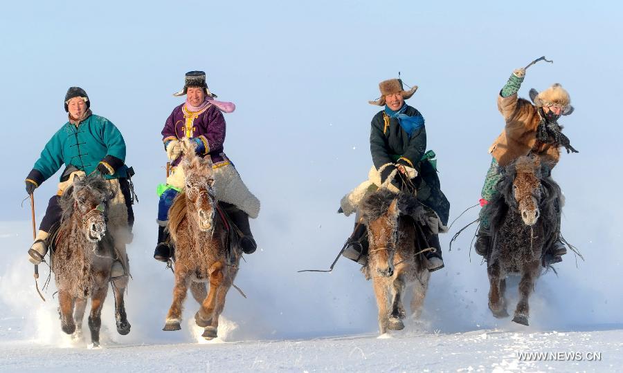 Photo taken on Jan. 1, 2011 shows people riding horses during a competition in Hulunbuir of north China's Inner Mongolia Autonomous Region. According to the Chinese lunar calendar, the upcoming lunar new year is the year of horse, which stands for strength, loyalty, boldness and vigorousness. (Xinhua/Pei Guoqing) 