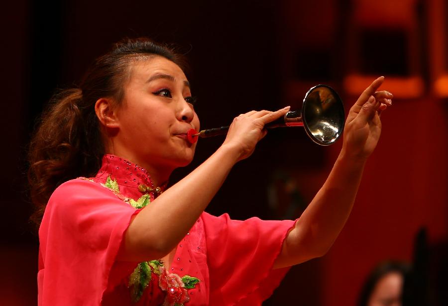 A Chinese suona player performs at a concert in Brussels, Belgium, Jan. 29, 2013. The Chinese Embassy in Belgium held a concert to celebrate the Lunar New Year on Wednesday. (Xinhua/Gong Bing)