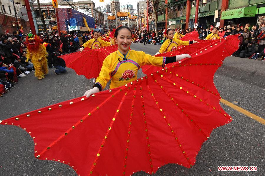 Girls perform during a Lunar New Year of the Horse Parade and celebration in Chinatown in Vancouver, Canada, Feb.2, 2014. The grand parade is one of the largest in North America, drawing more than 80,000 people to the streets of Chinatown. (Xinhua/Sergei Bachlakov) 