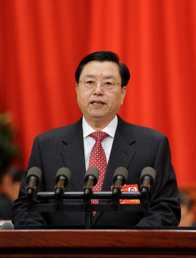 China's top legislator delivers NPC Standing Committee work report