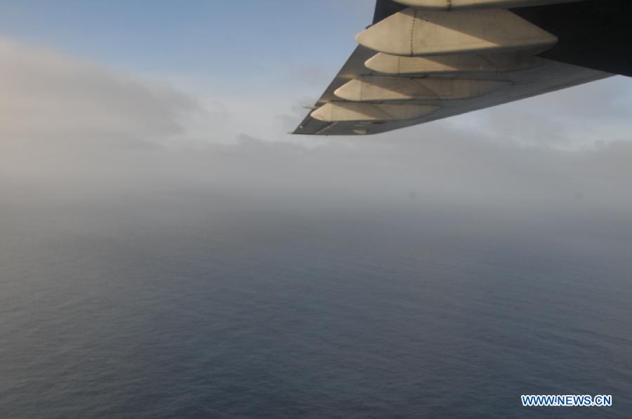 Chinese plane crew spots suspicious objects in search area for missing MH370 