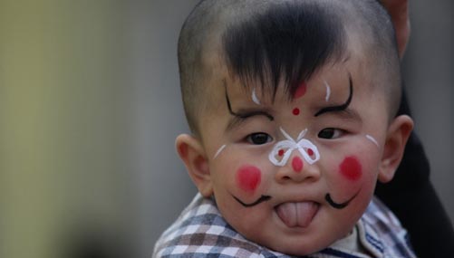 Little painted faces at temple fair