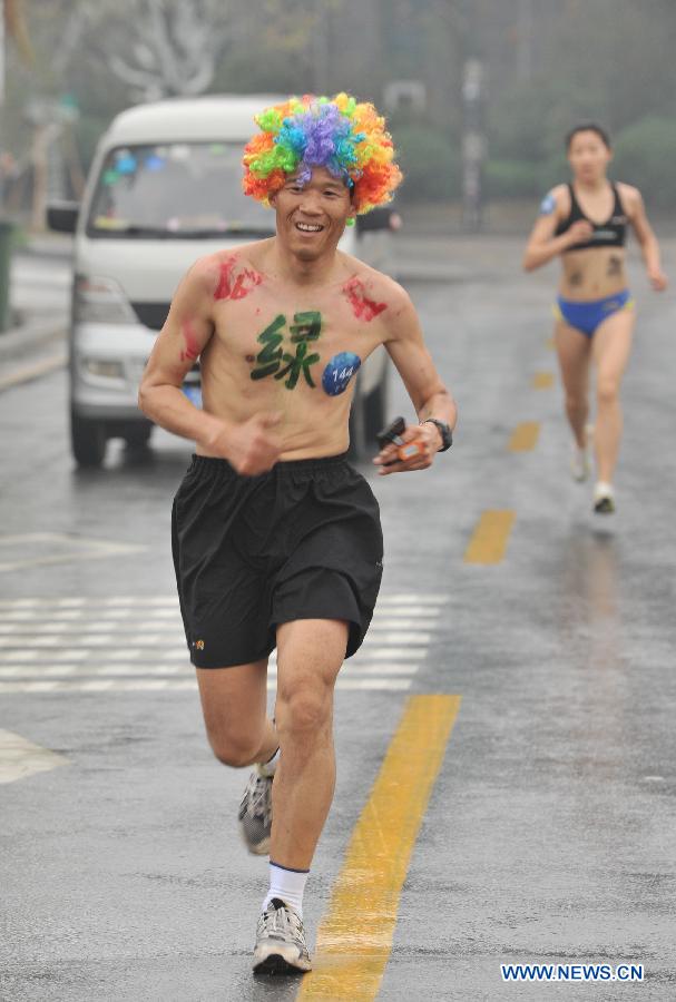 People wearing underwear take part in a running race in Nanjing, capital of east China's Jiangsu Province, March 29, 2014. A special race was held here on Saturday, in which participants wore only underwear so as to advocate the 2014 Earth Hour event and promote the concept of green lifestyle. (Xinhua/Shen Peng) 