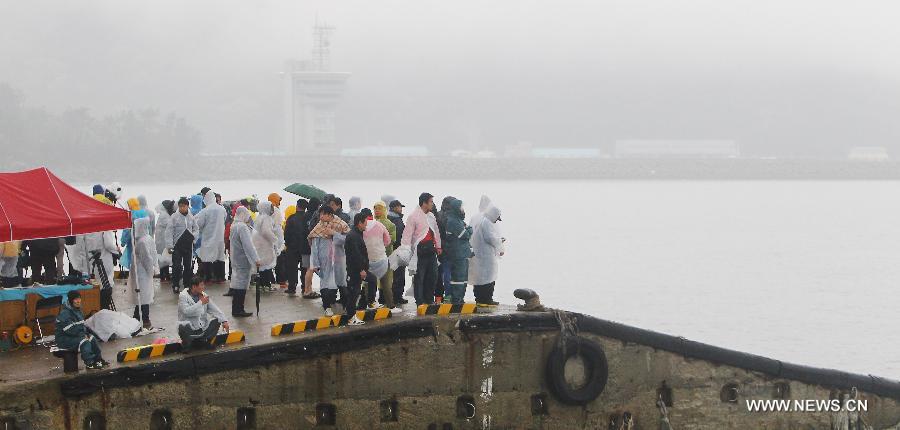 Relatives of missing passengers aboard sunken vessel wait for rescue news