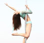 Pole dancer shows strength and beauty up in the air