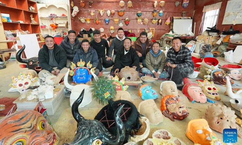 Craftsmen pose for a group photo at a workshop of a cooperative in Dagze District of Lhasa, southwest China's Xizang Autonomous Region, Dec. 9, 2024. (Photo: Xinhua)