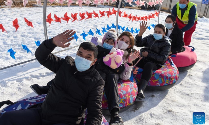 Tourists play on snow tubes at Oynak ski resort in Moyu County, northwest China's Xinjiang Uygur Autonomous Region, Jan. 9, 2022. Located on the southern brim of the Taklimakan Desert, Moyu County barely snows in winter. In order to boost its winter tourism and extend the tourism season, the county built Oynak ski resort by making artificial snow, fueling people's passion for winter sports here. (Photo: Xinhua)